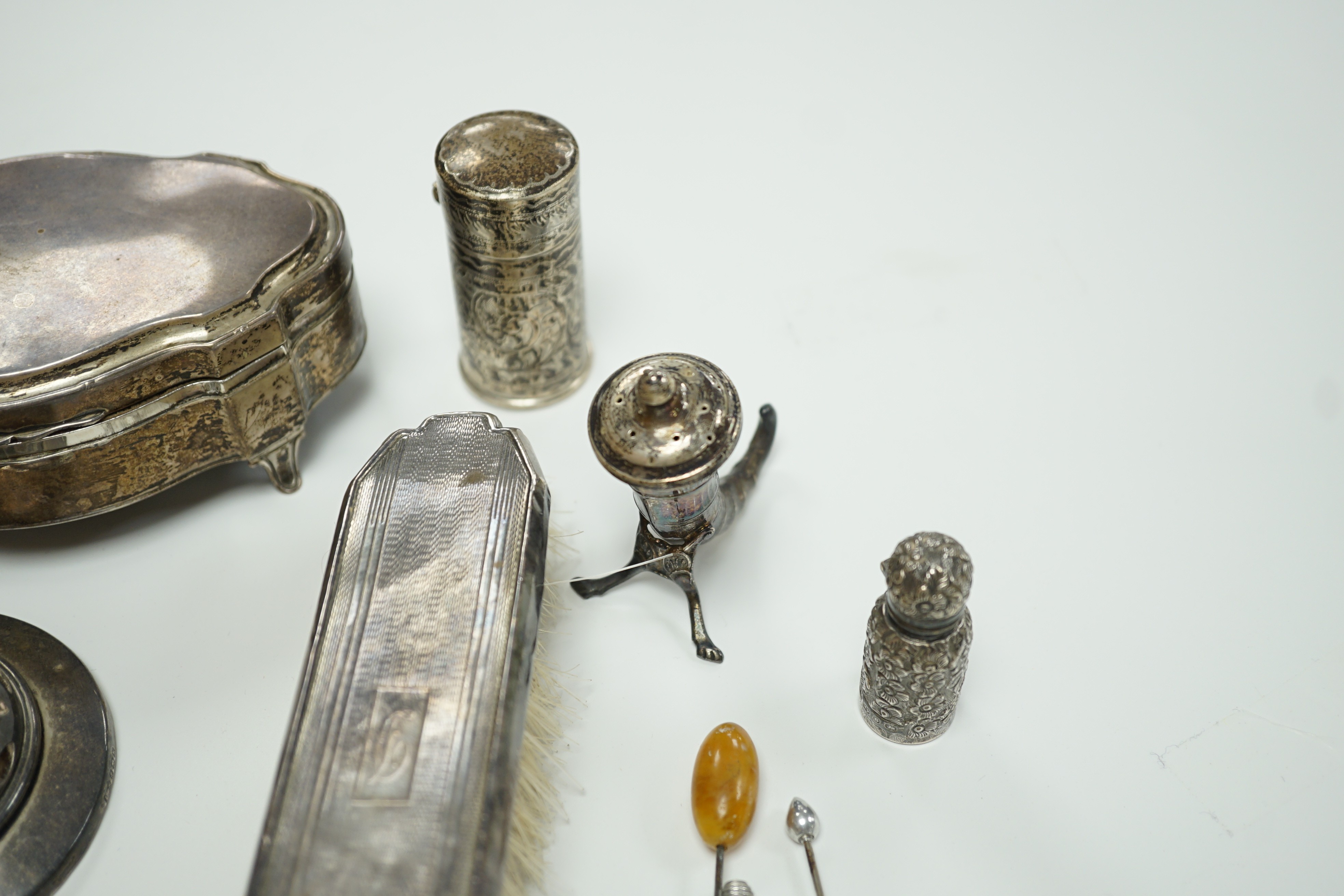 A George V silver mounted trinket box, Elkington & Co, Birmingham, 1918, 13.1cm, a silver mustard pot, two Scandinavian 925 condiments, two silver mounted scent bottles, hatpins and hatpin stand and a silver mounted thre